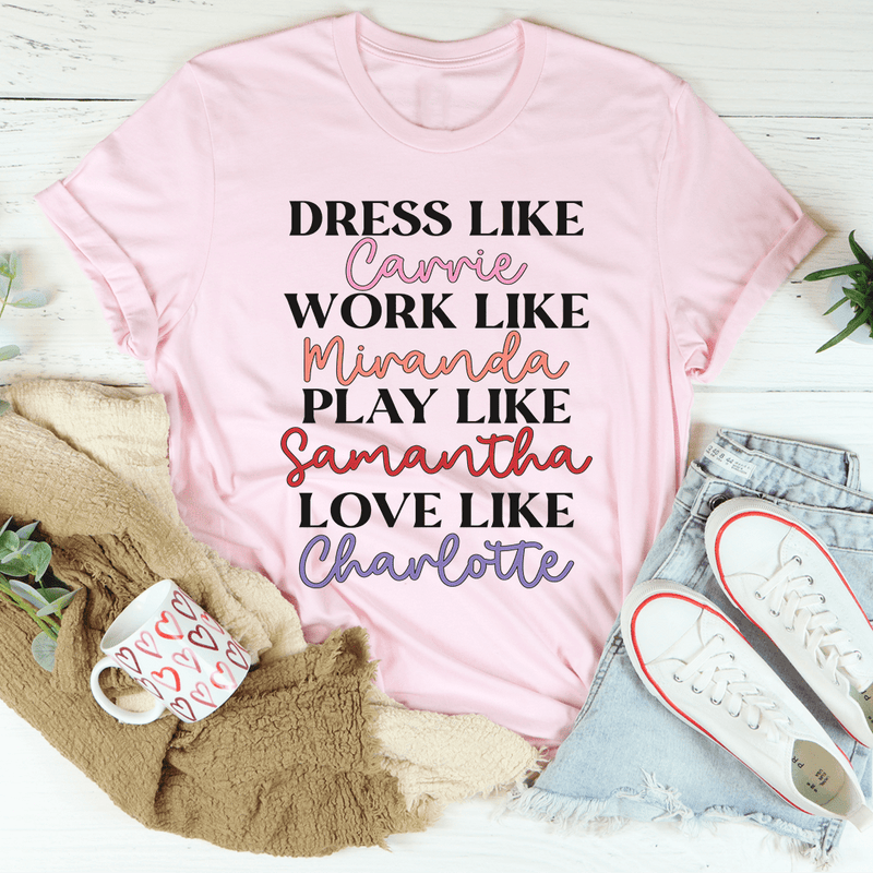 Stylish t-shirt featuring the phrase 'Dress Like Carrie Work Like Miranda Play Like Samantha' in a comfortable fit.